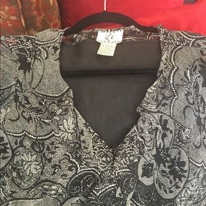 Black and white top with ruffle neck and s…